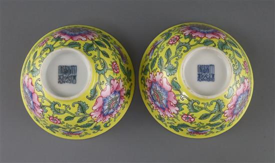 A pair of Chinese yellow ground famille rose bowls, Daoguang six character seal mark and probably of the period (1821-50), Diam.11.5cm